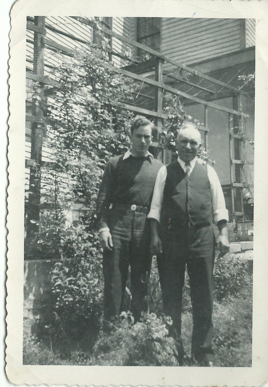 Photo of Winemaking family standing next to some of their vines
