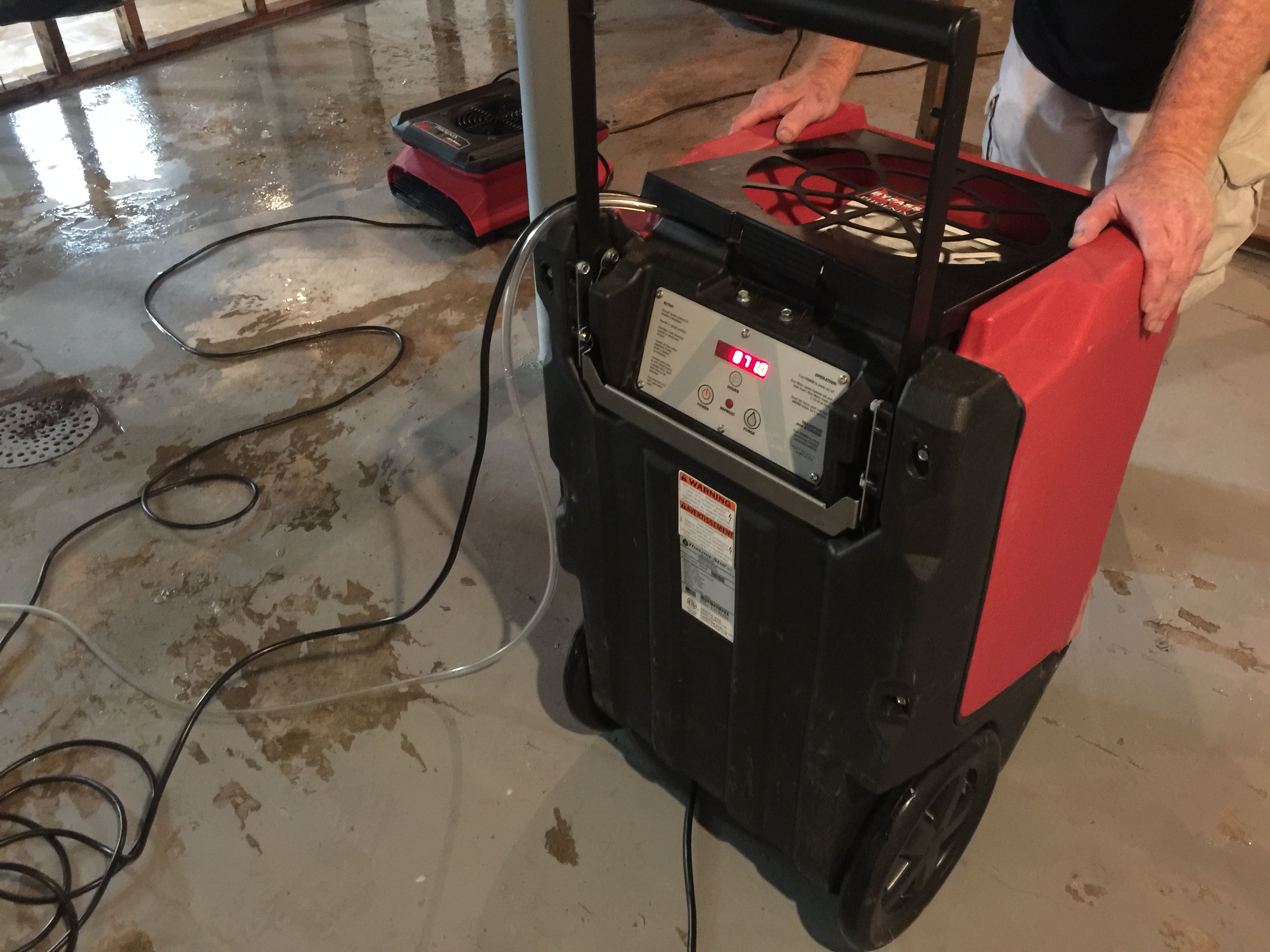 Closeup photo of a professional dryer in a basement